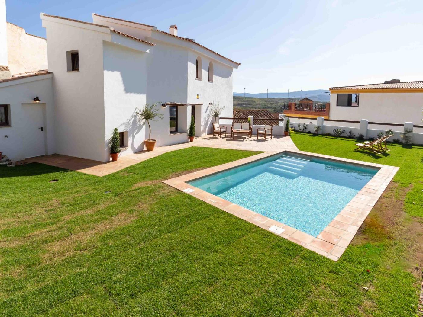 Magnificent rustic house with pool, garden, and views in Acequias